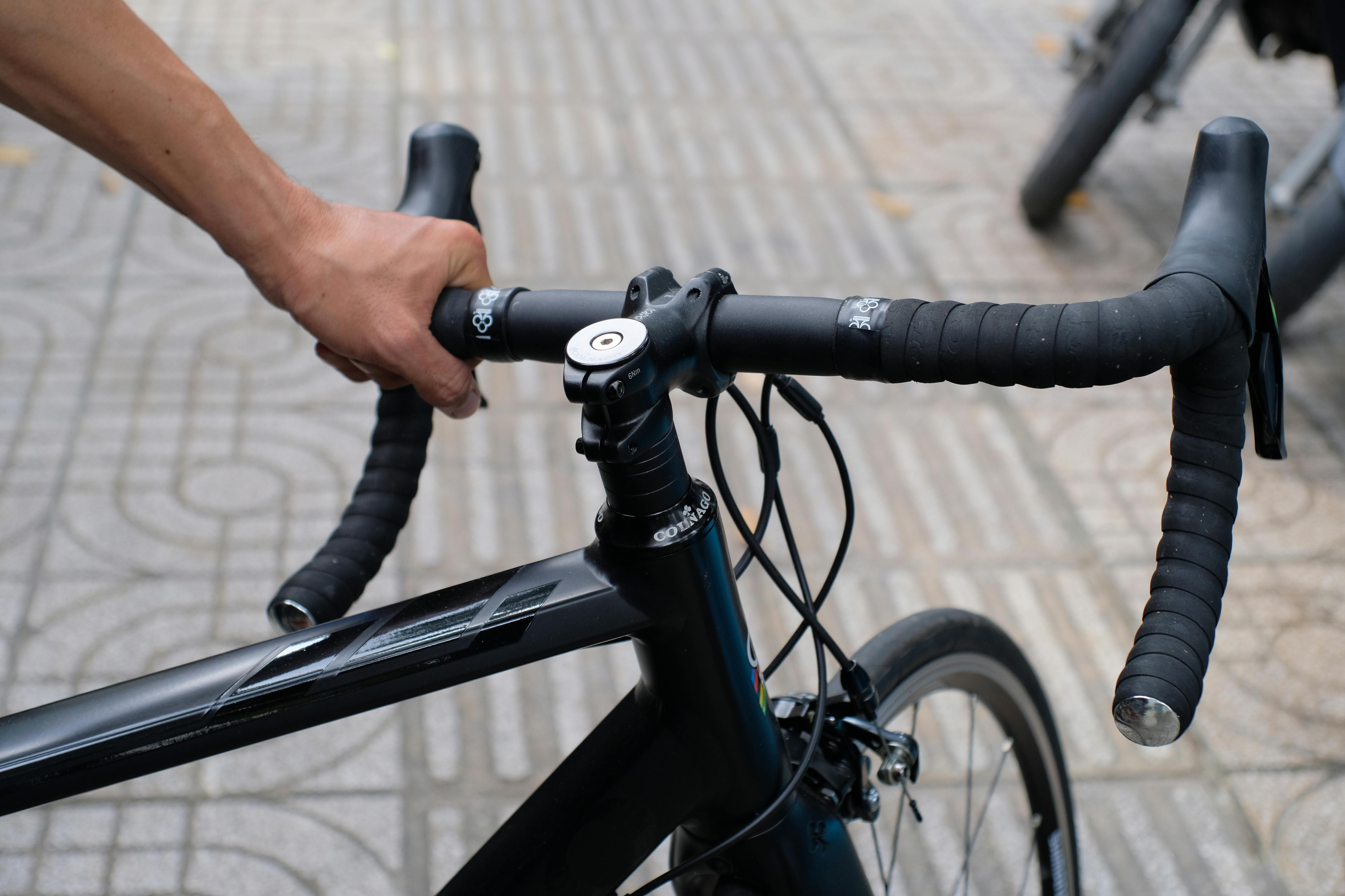 Person Holding the Handlebar of a Bicycle · Free Stock Photo