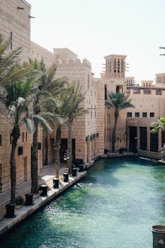 Explore the stunning architecture and palm-lined waterways of Madinat Jumeirah in Dubai, UAE.