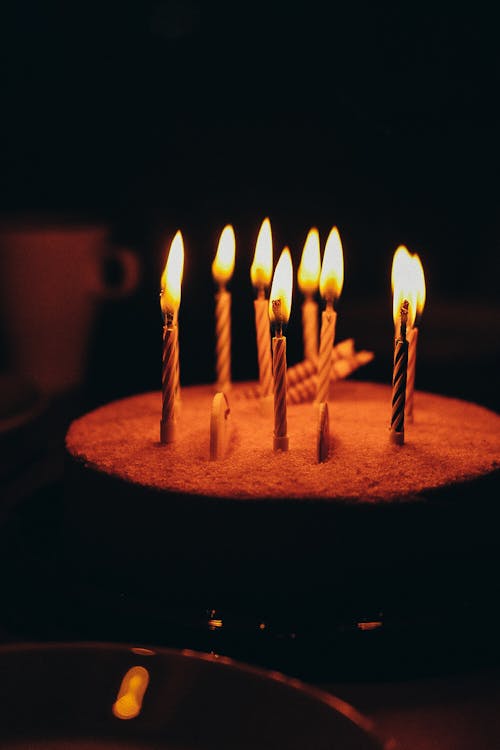 Burning Candles on Birthday Cake