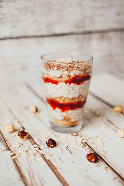 Close-up of a Glass with Pudding, Sauce and Nuts 