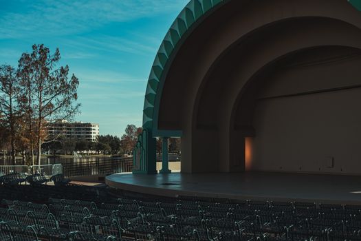 A view of an outdoor amphitheatre with empty seating in sunny Orlando.