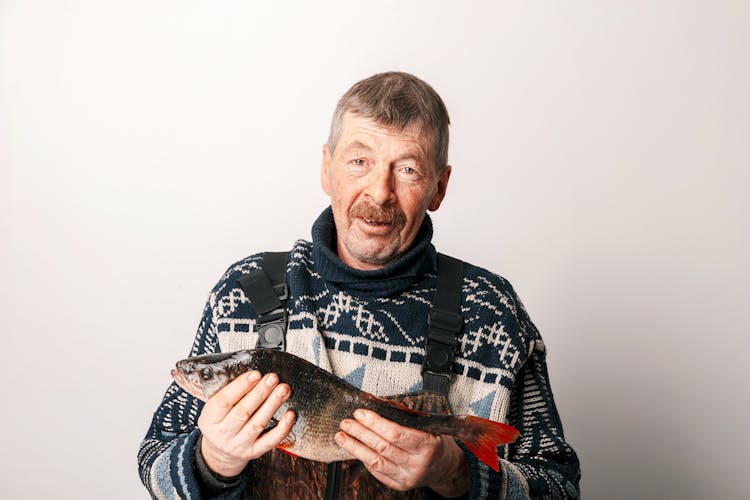 Man Holding A Fish 