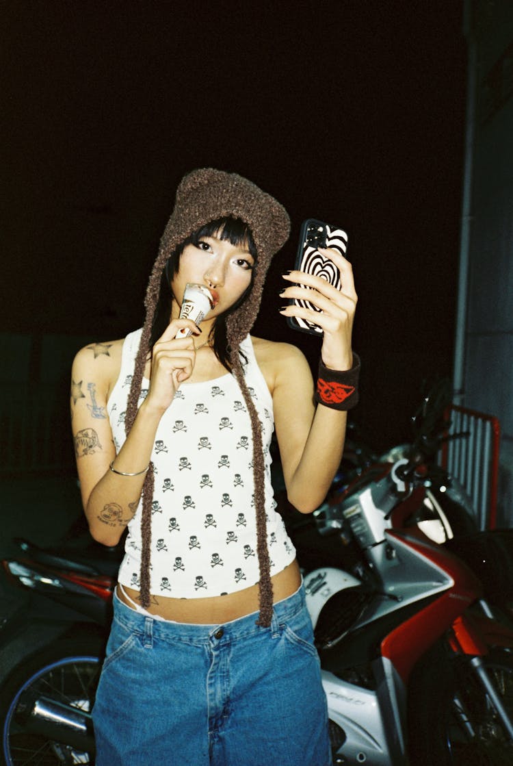 Portrait Of A Young Woman Eating An Ice Cream At Night