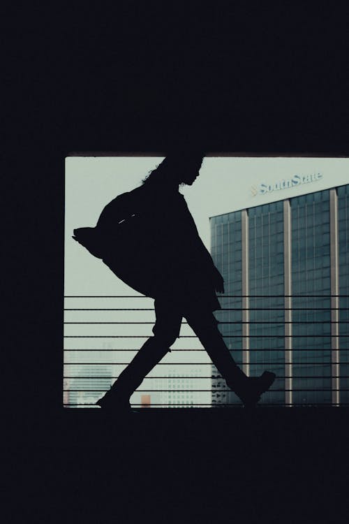Silhouette of Woman in City
