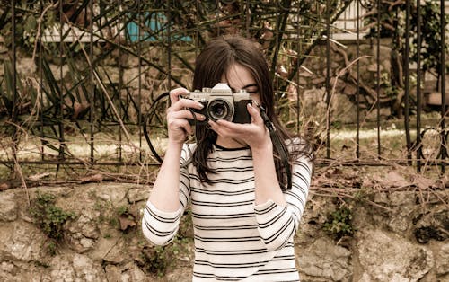 Woman Taking Photo with a Camera