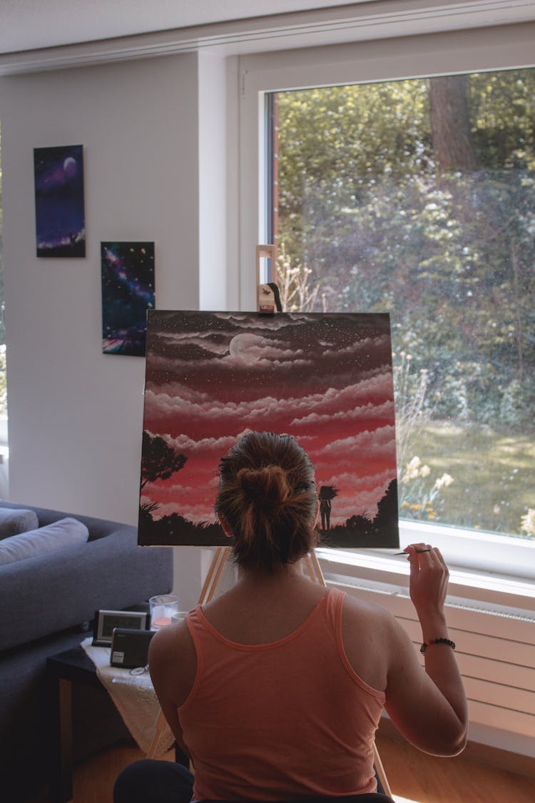 Woman Painting On Canvas At Home 