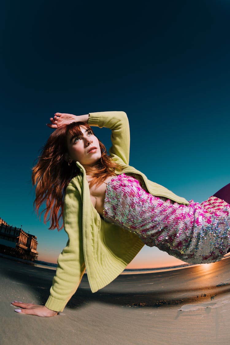 Pretty Redhead Posing On A Beach At Sunset