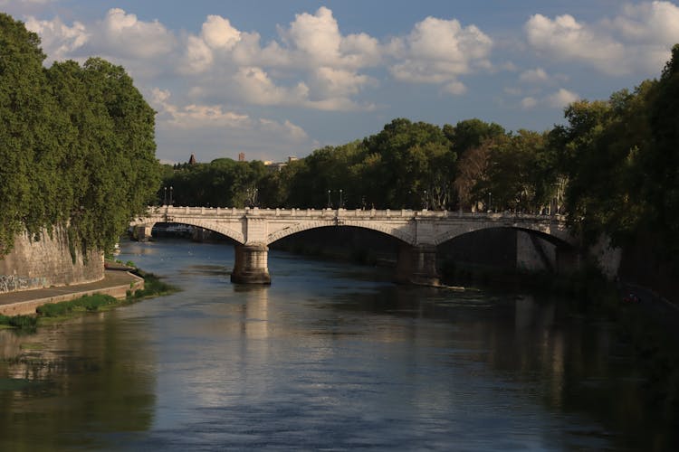 Stone Bridge Above River Near Park