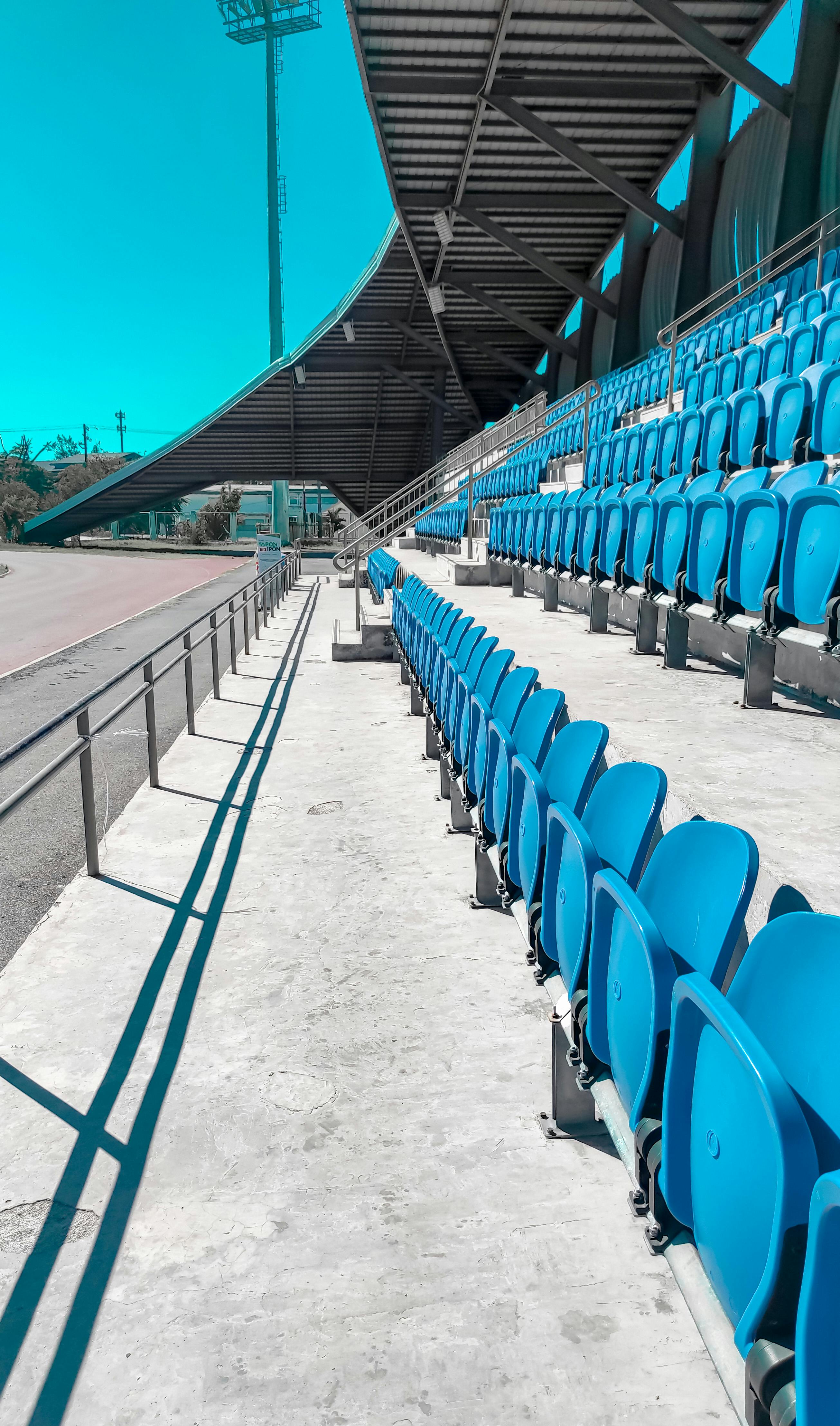 Red and Black Stadium Seats · Free Stock Photo