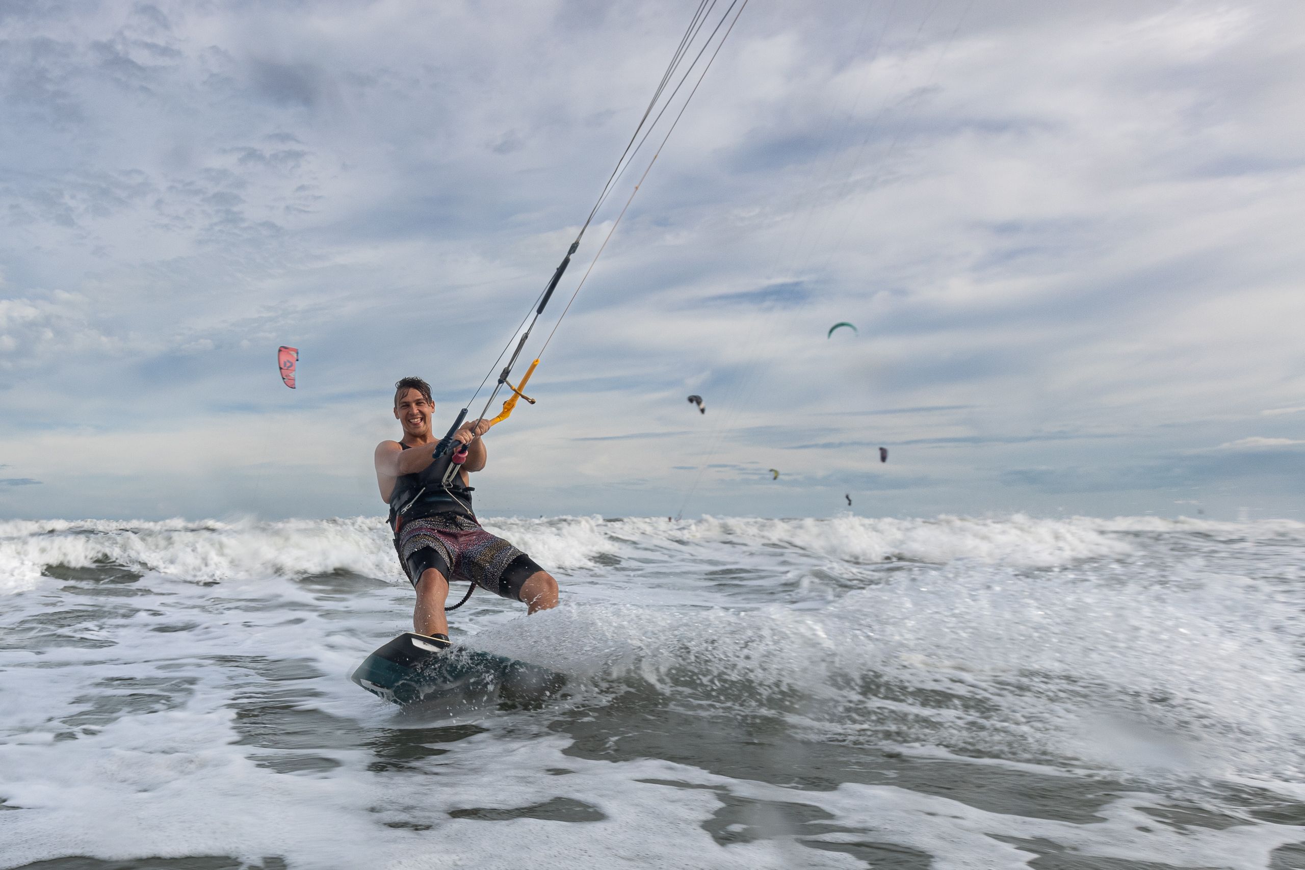 A Man Kiteboarding in the Sea · Free Stock Photo