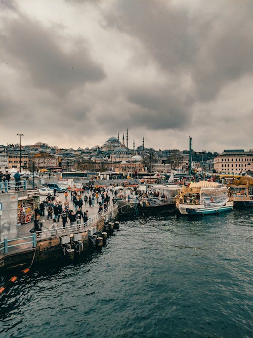 People on Boardwalk in City Port