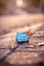 Blue Volkswagen Beetle Coupe in Selective-focus Photography