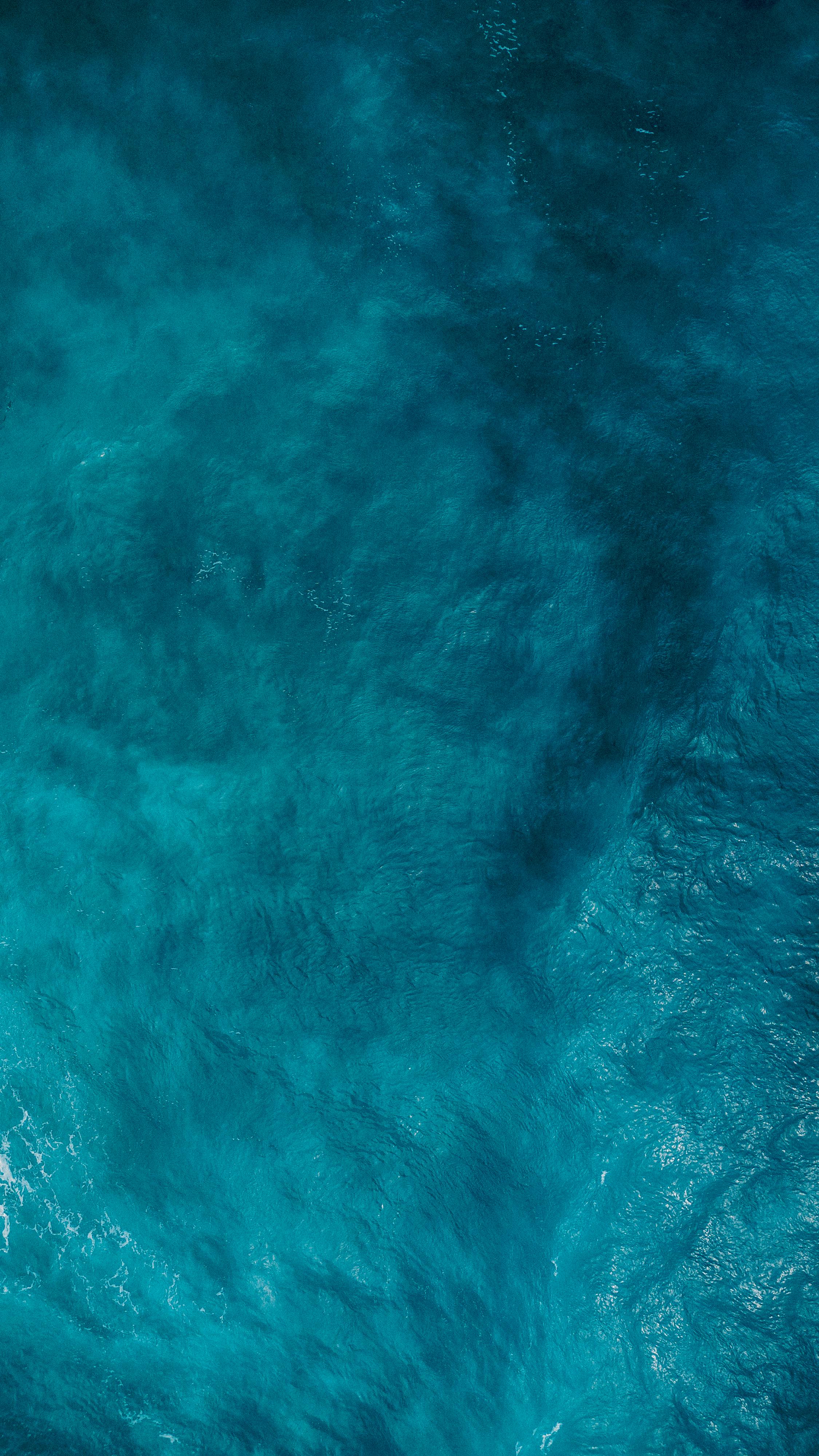 Top View of a a Boat Sailing in a with Turquoise Water · Free Stock Photo