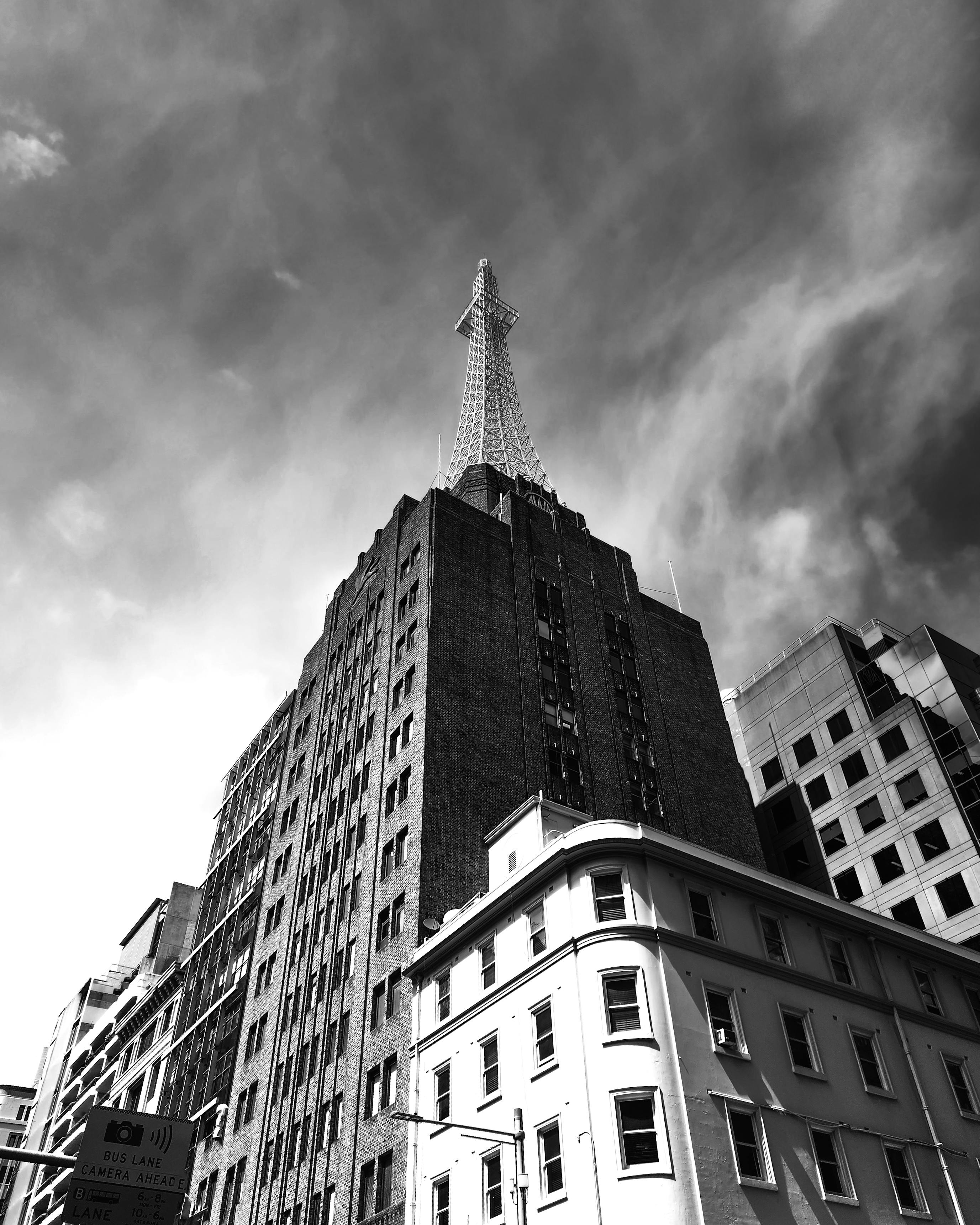 Low Angle Shot of Buildings and the AWA Tower in the Background