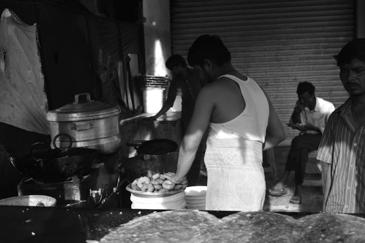 Men Cooking On The Street 