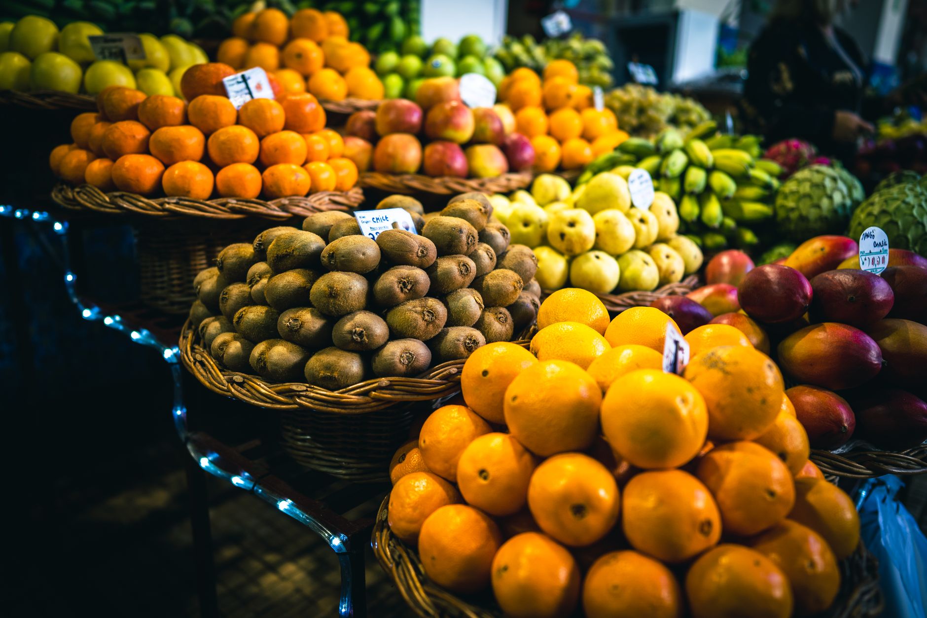 A colorful assortment of fresh fruits on display in a market, showcasing abundance and variety.
