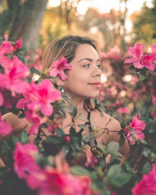 Woman Posing among Flowers