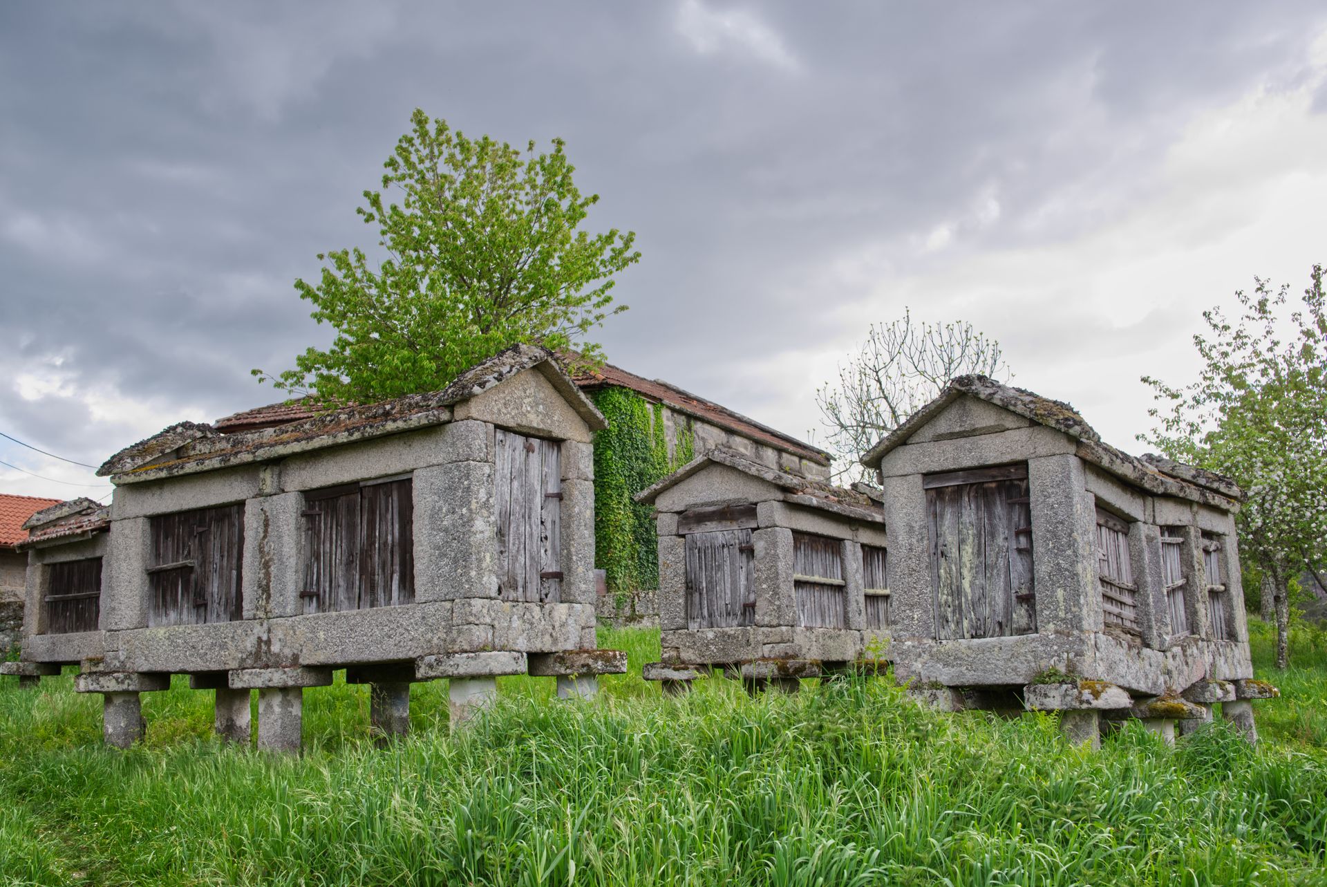 An old yellow granary building in a rural setting