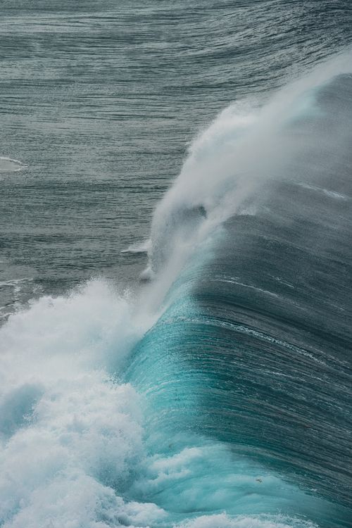 Free Dramatic ocean wave crashes against the shore capturing the power and beauty of nature in Spain. Stock Photo