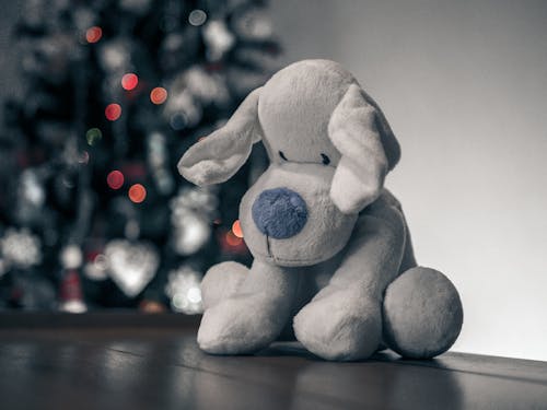 Close-up of a Cuddly Toy on the Background of a Christmas Tree