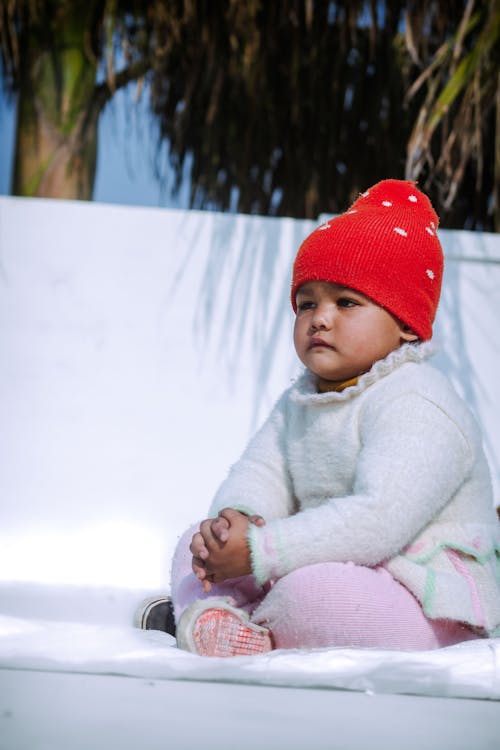 Girl Wearing a Read Beanie