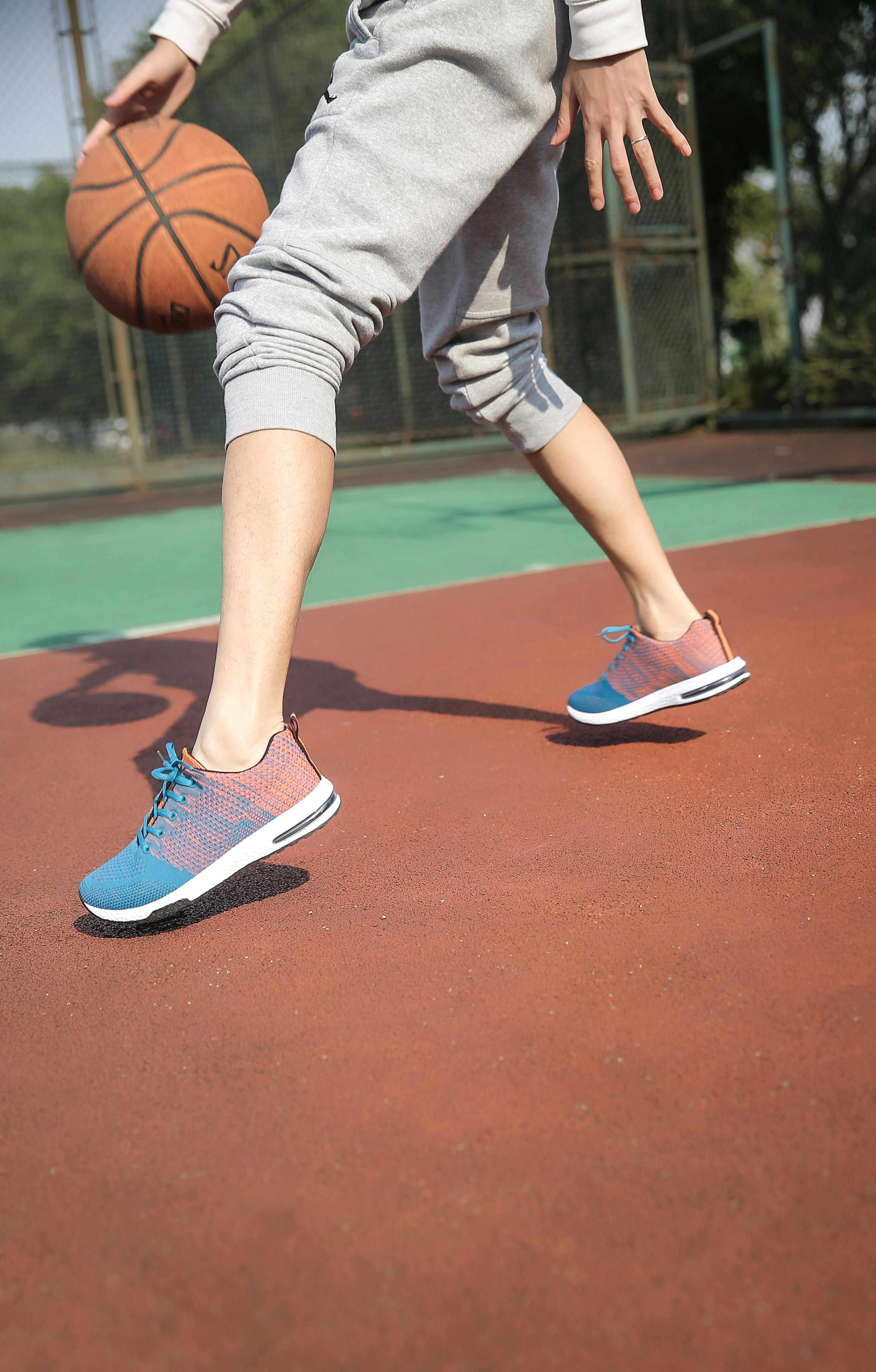 person-dribbling-basketball-free-stock-photo