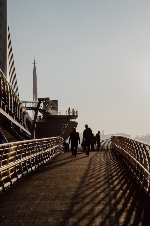 Free People Walking down the Elevated Footbridge  Stock Photo