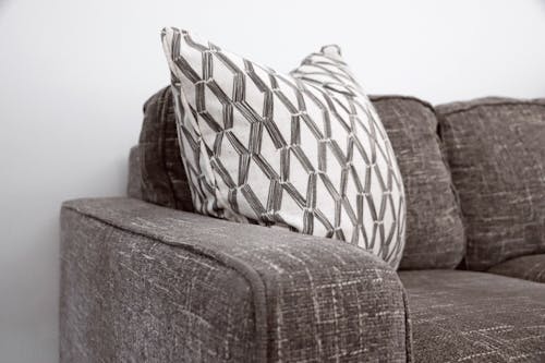 Free Throw Pillow on Sofa Stock Photo