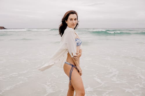 Free Woman Posing on Sea Shore Stock Photo