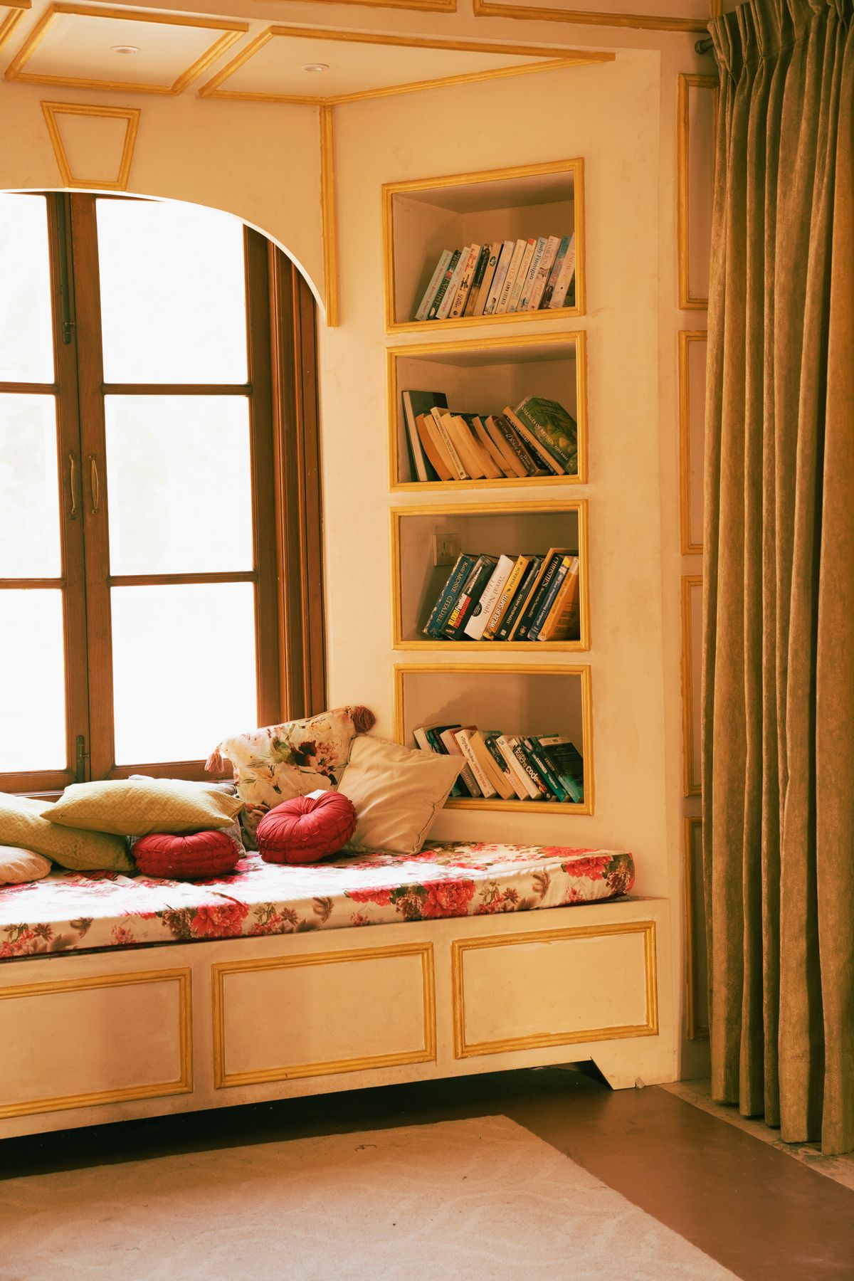 Light and airy cozy reading nook with soft pillows and natural light