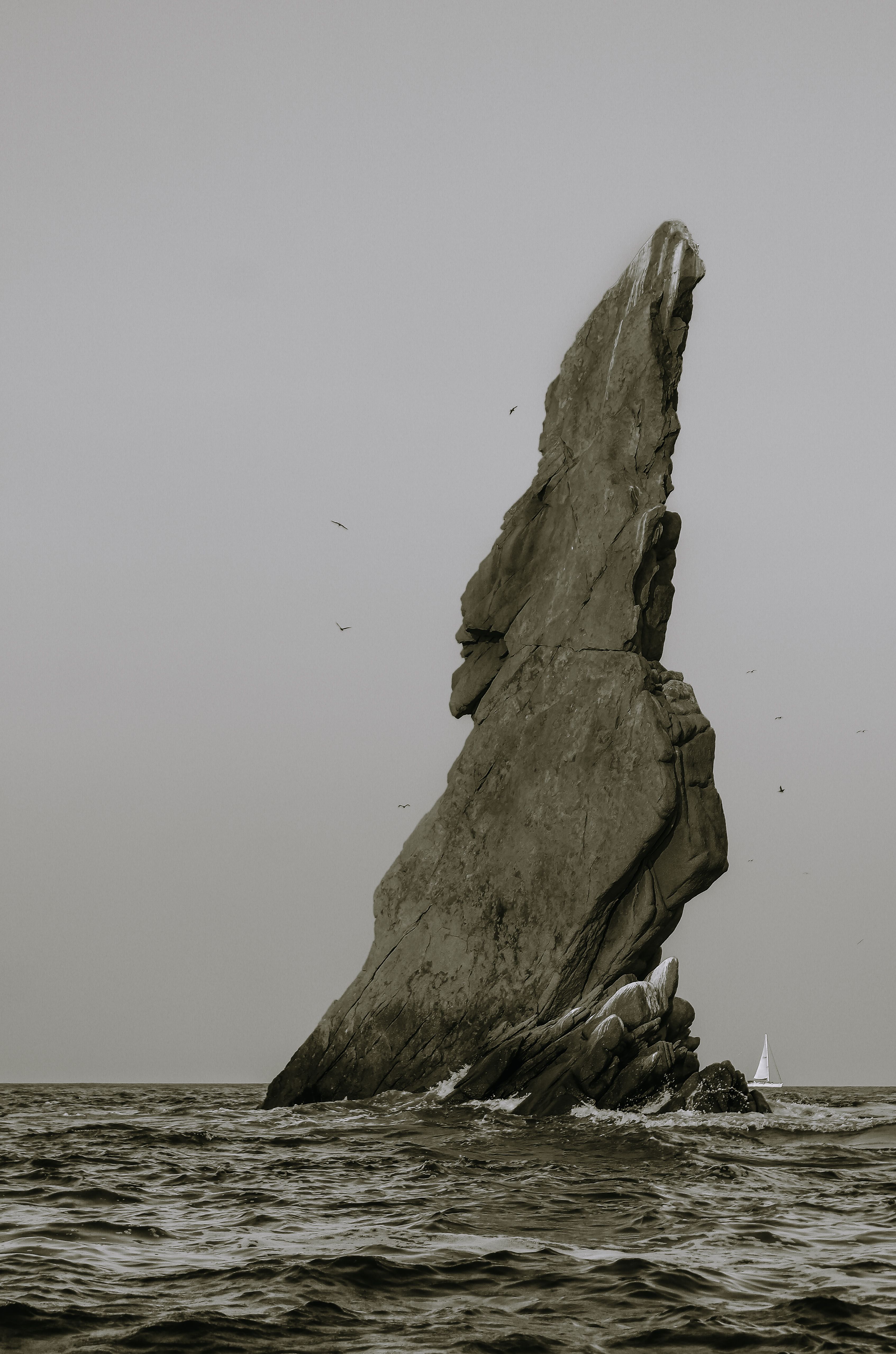 Rock Sticking Out Sea · Free Stock Photo