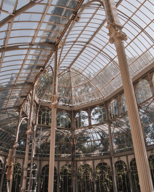 Stunning interior view of Palacio de Cristal, Madrid, highlighting glass architecture.