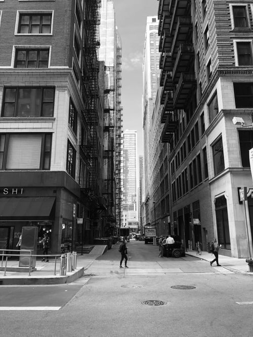 Free Black and white street view of Chicago's urban architecture with people walking. Stock Photo