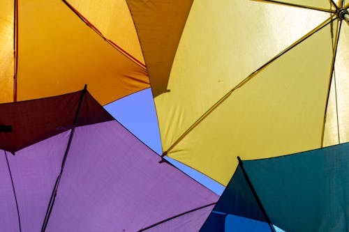 Colorful Umbrellas on Sky Background