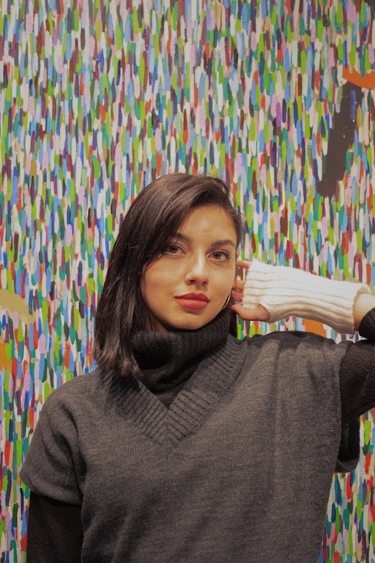 Girl In Knitwear Posing On Colorful Background