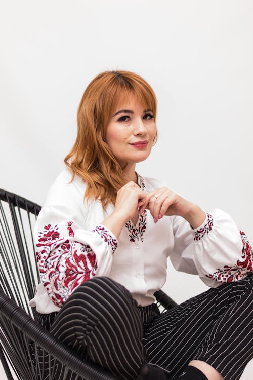 Smiling Woman Sitting and Posing