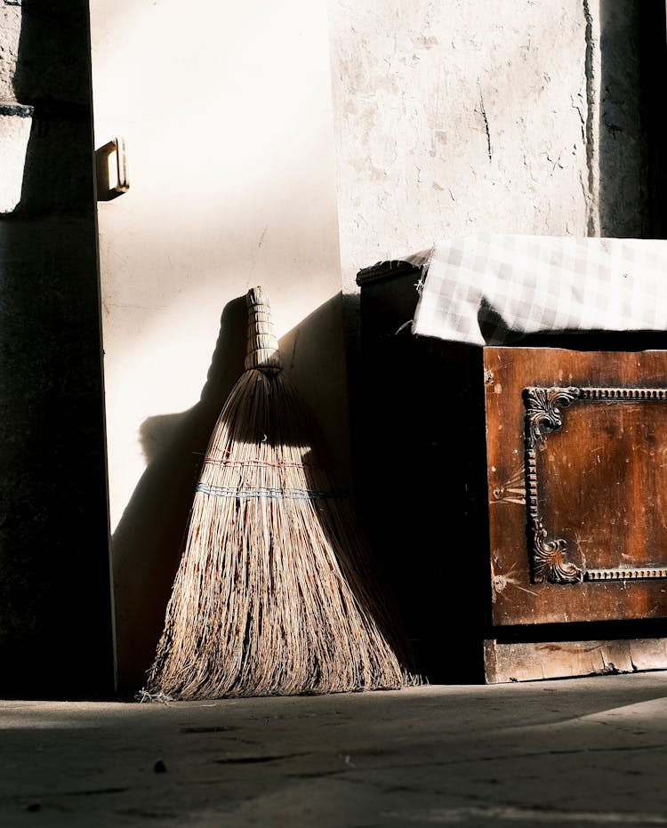 Broom Against A Building Wall 