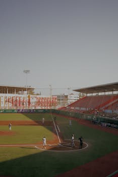 A lively baseball game unfolding at a vibrant stadium in Veracruz, Mexico.