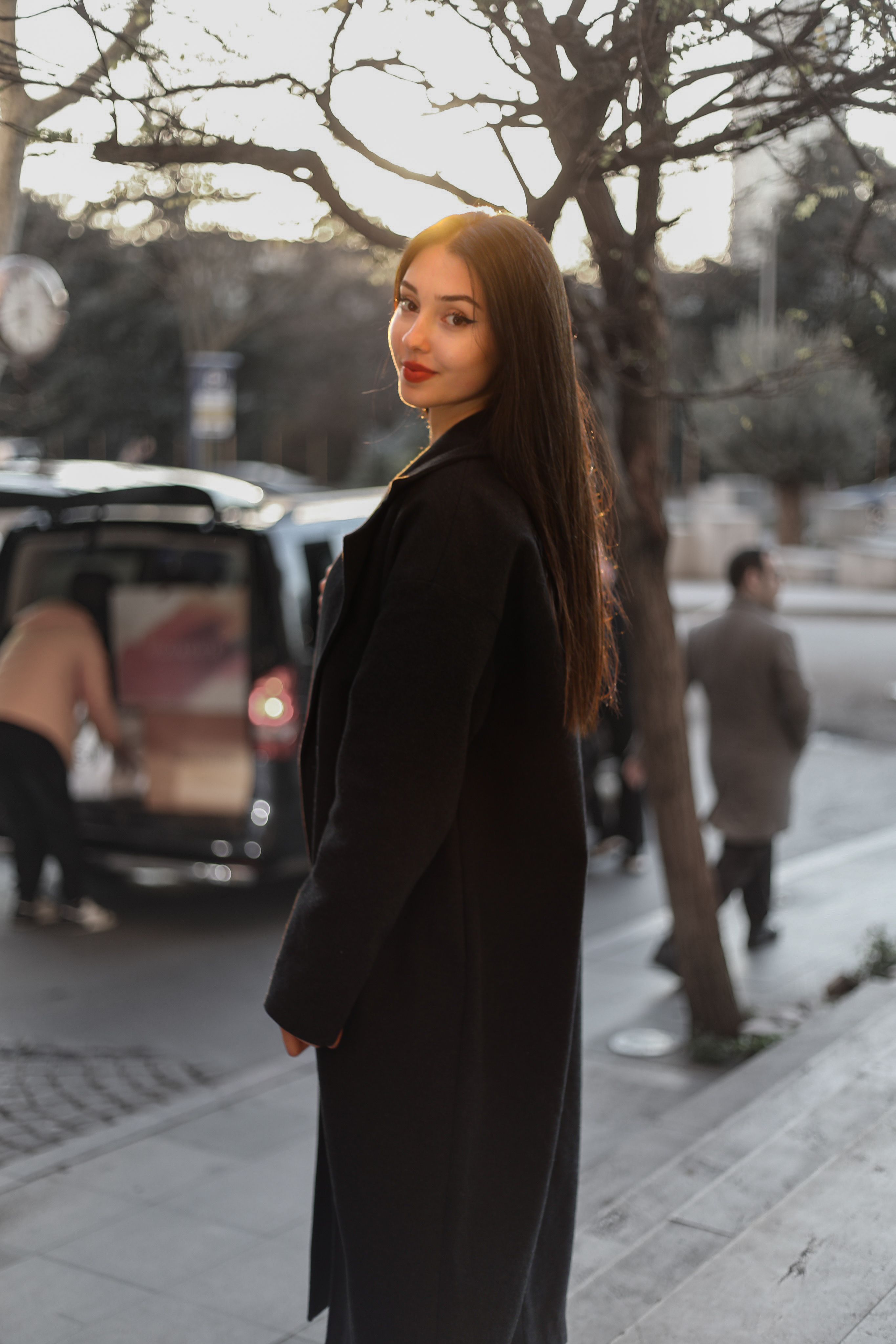 Woman in Black Outfit Standing on Sidewalk · Free Stock Photo