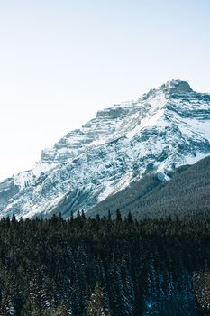 Stunning snow-covered mountain in Banff National Park, Alberta, showcasing breathtaking natural beauty.