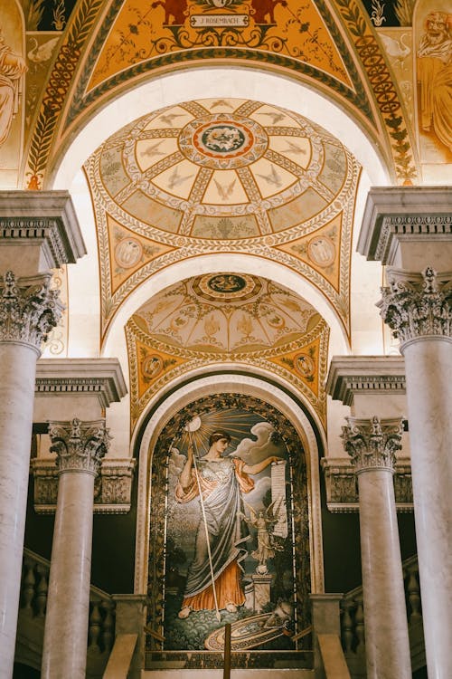 Free The ceiling of a church with a painting on it Stock Photo