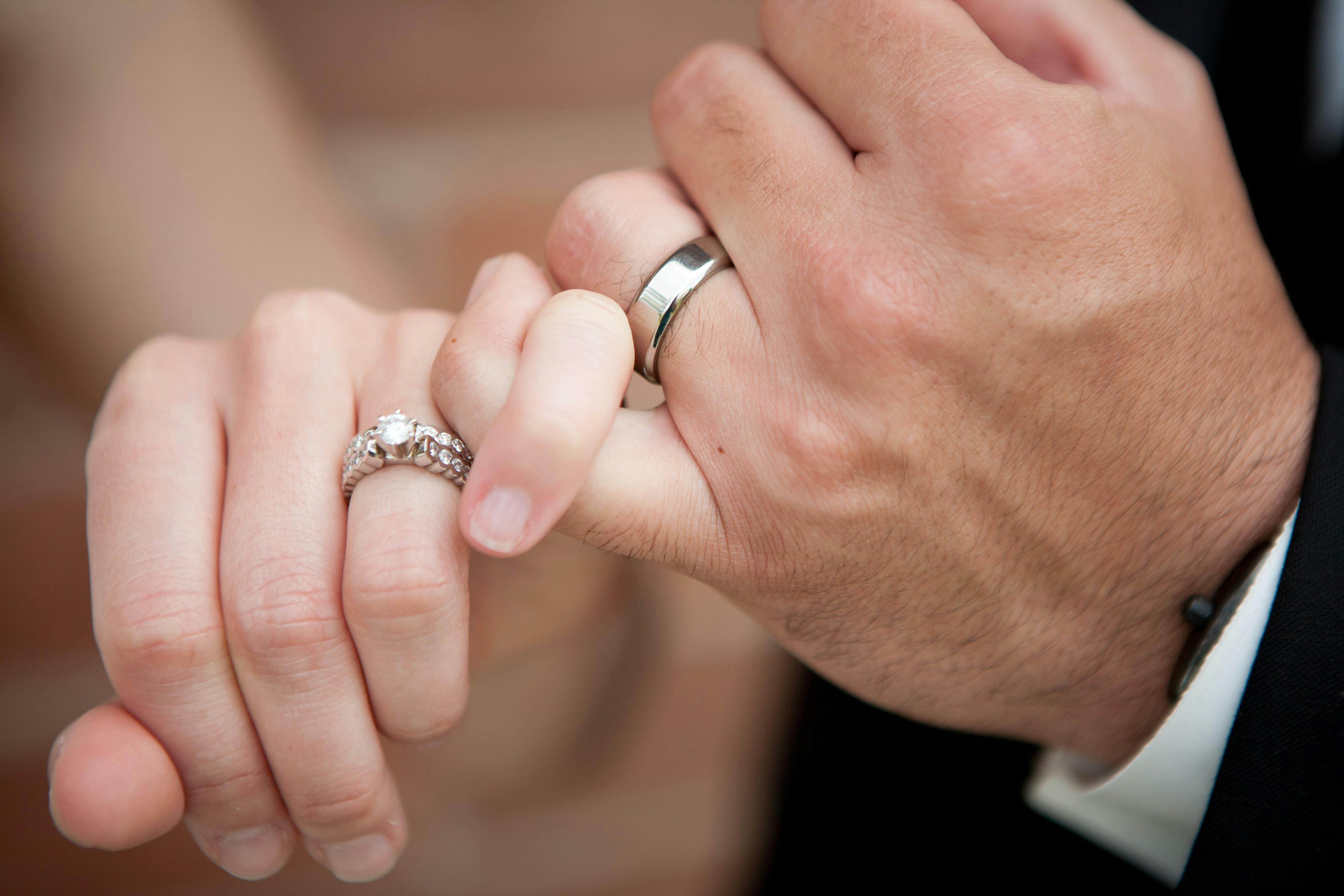 Couple hand with engagement fashion ring