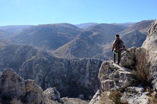 Free A lone hiker surveys the breathtaking mountainous landscape in Türkiye, evoking a sense of adventure and serenity. Stock Photo