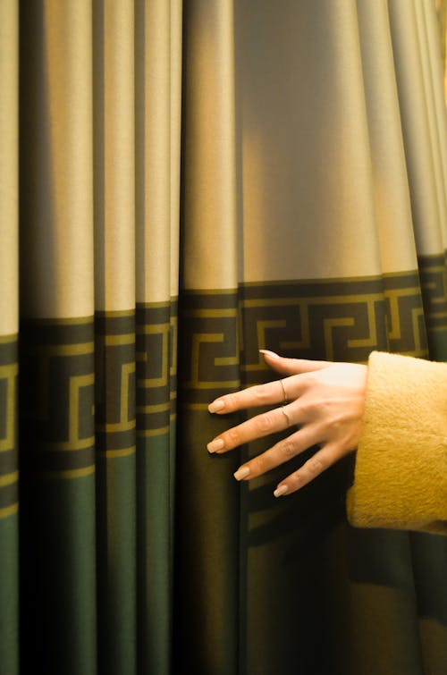 Woman Hand Touching Curtain