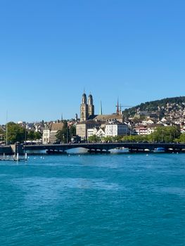 Beautiful daytime view of the Grossmünster church and river in Zürich, Switzerland.