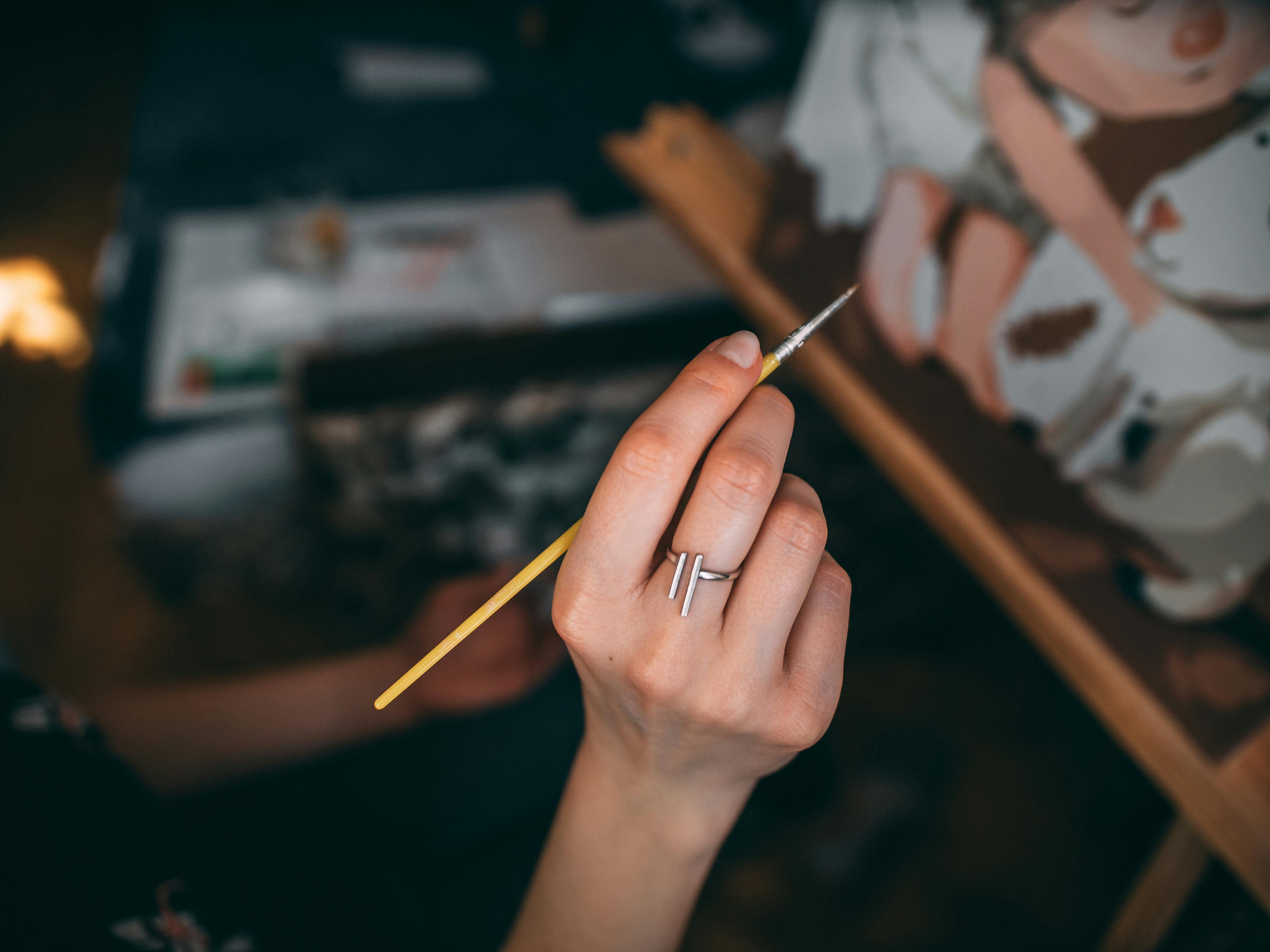 artist painting on the canvas