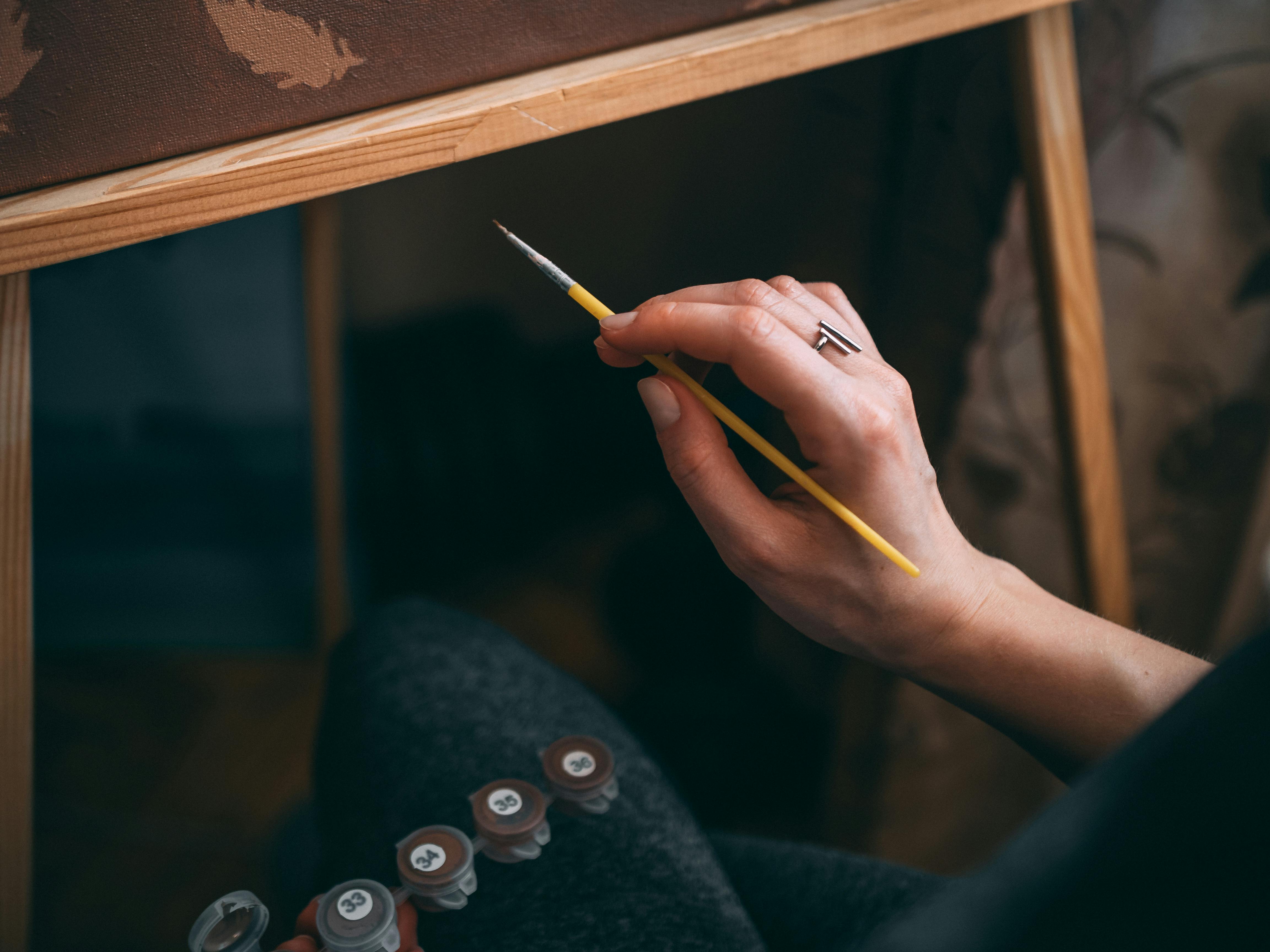 artist painting on the canvas