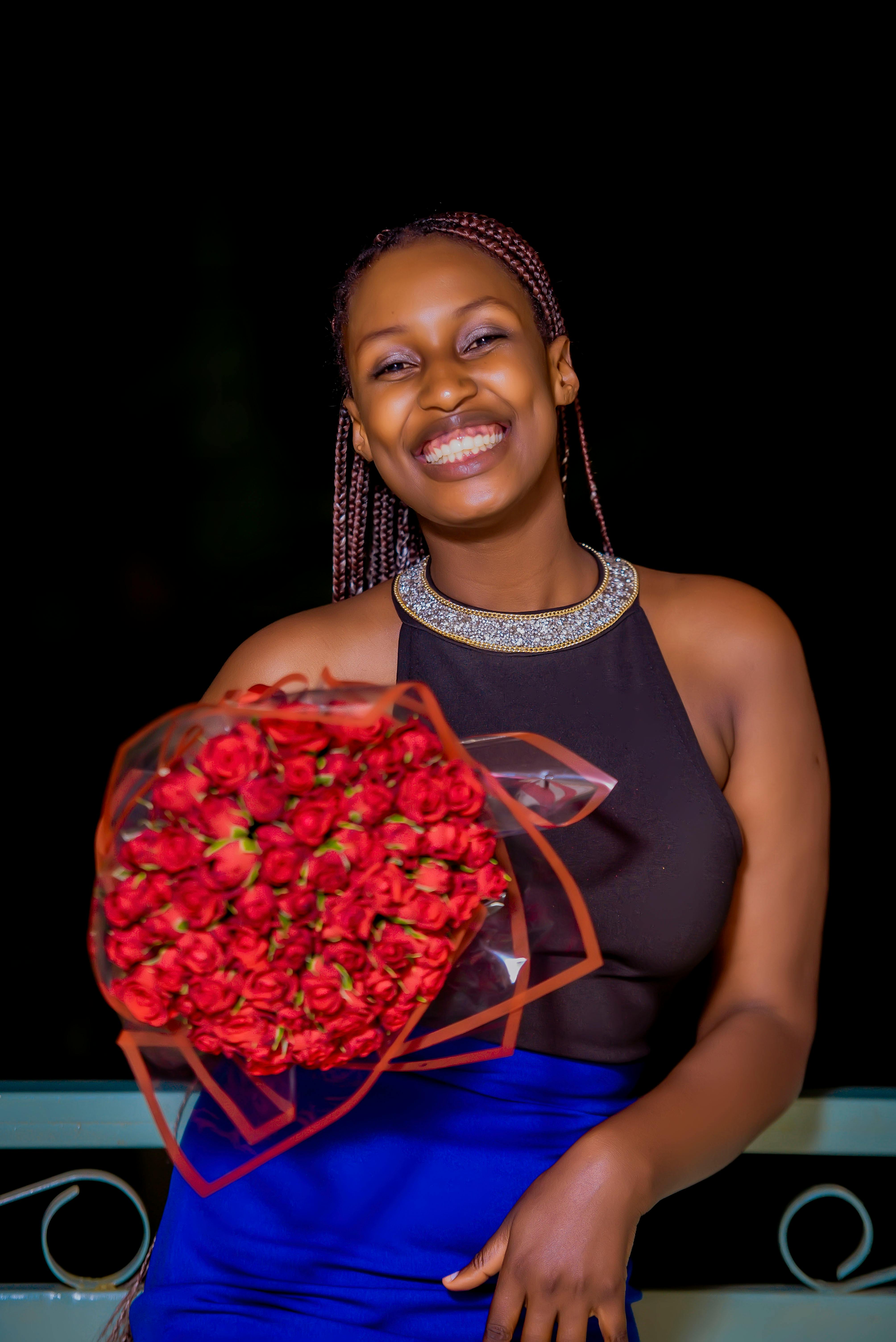 Woman in Red Peignoir Holding Bouquet Free Stock Photo