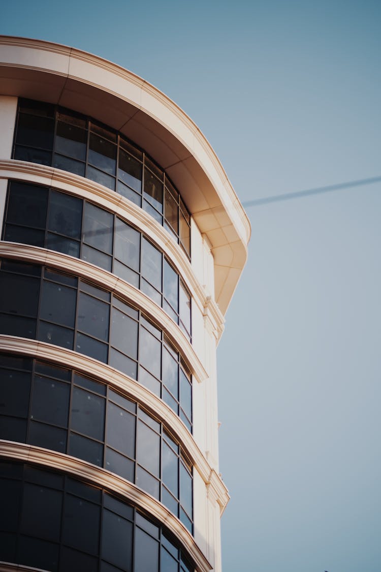 Curved Building Side Against Blue Sky