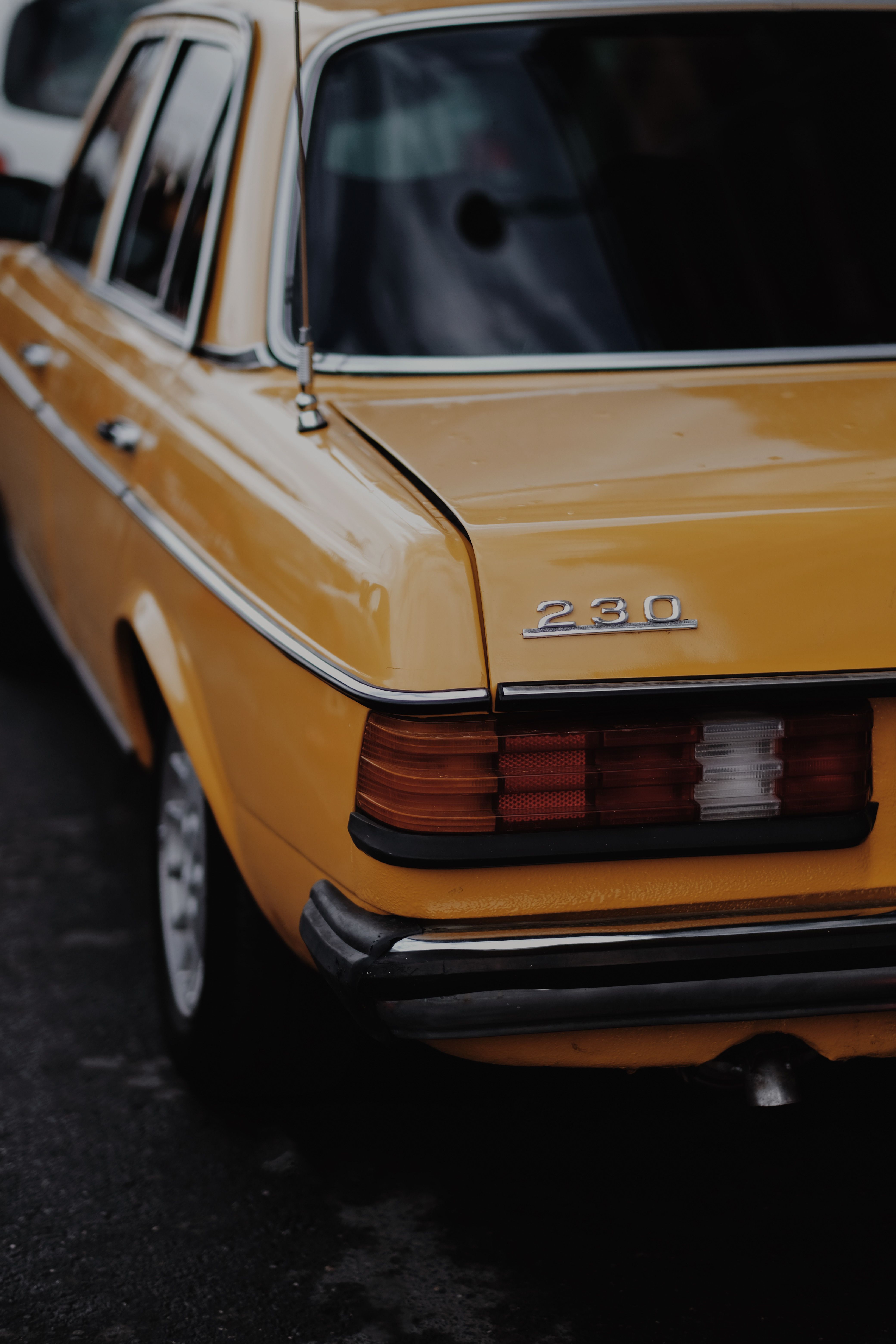 Rear of a Yellow Vintage Car · Free Stock Photo